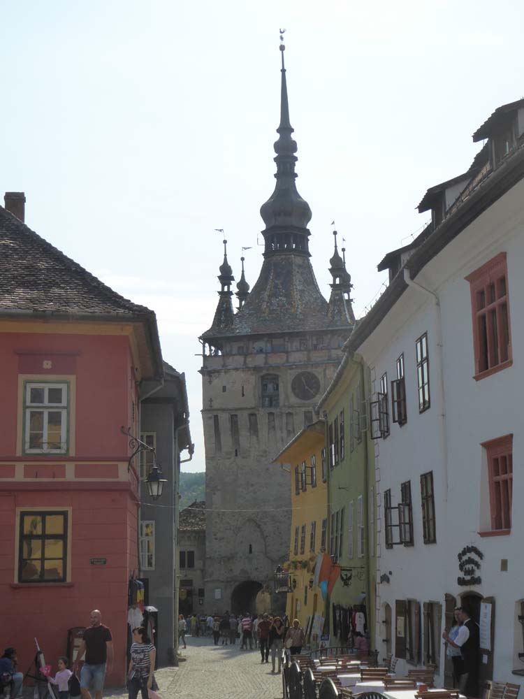 ROMANIA - Sighisoara medieval village, with clock tower and Vlad Dracul house (yellow)